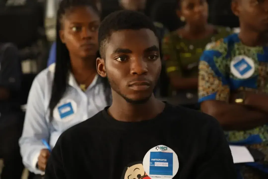 Participants listen to a presentation.