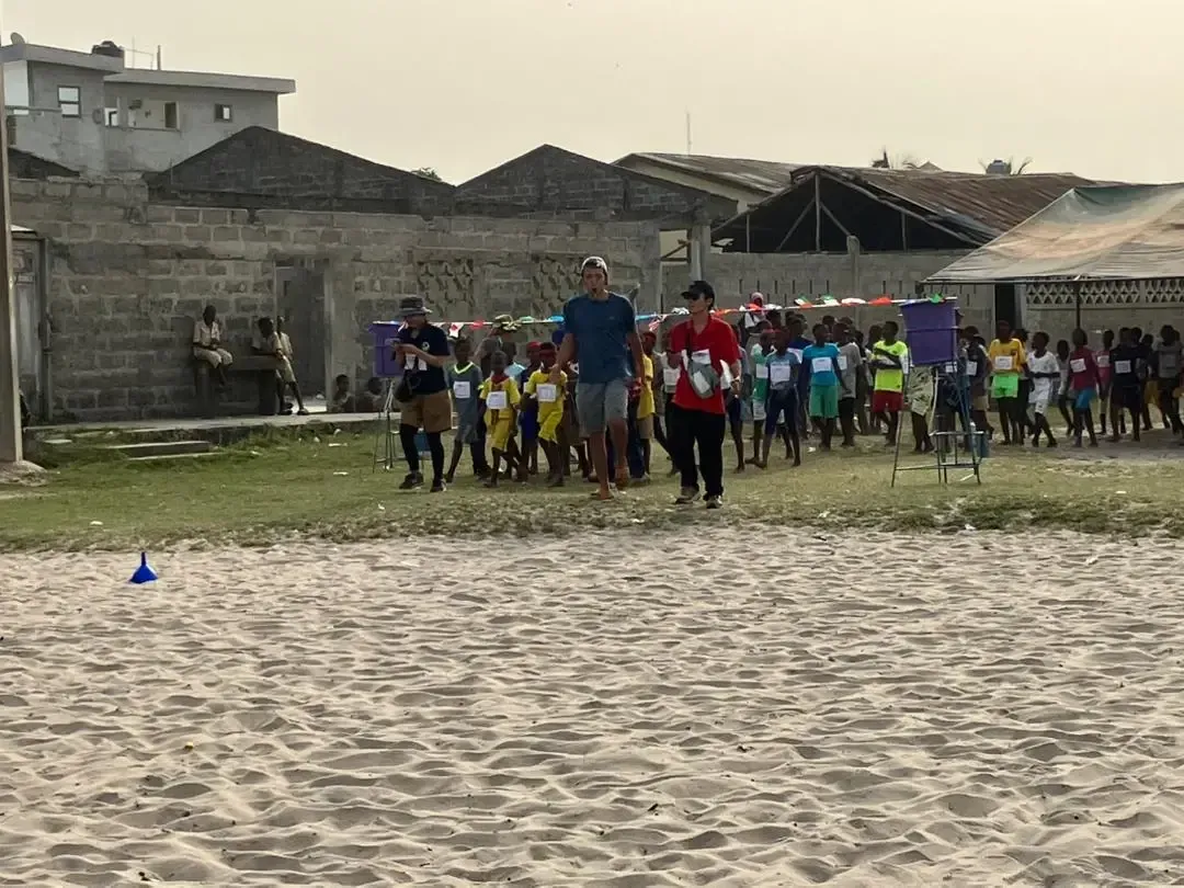 Sports activities on a large sandy field.