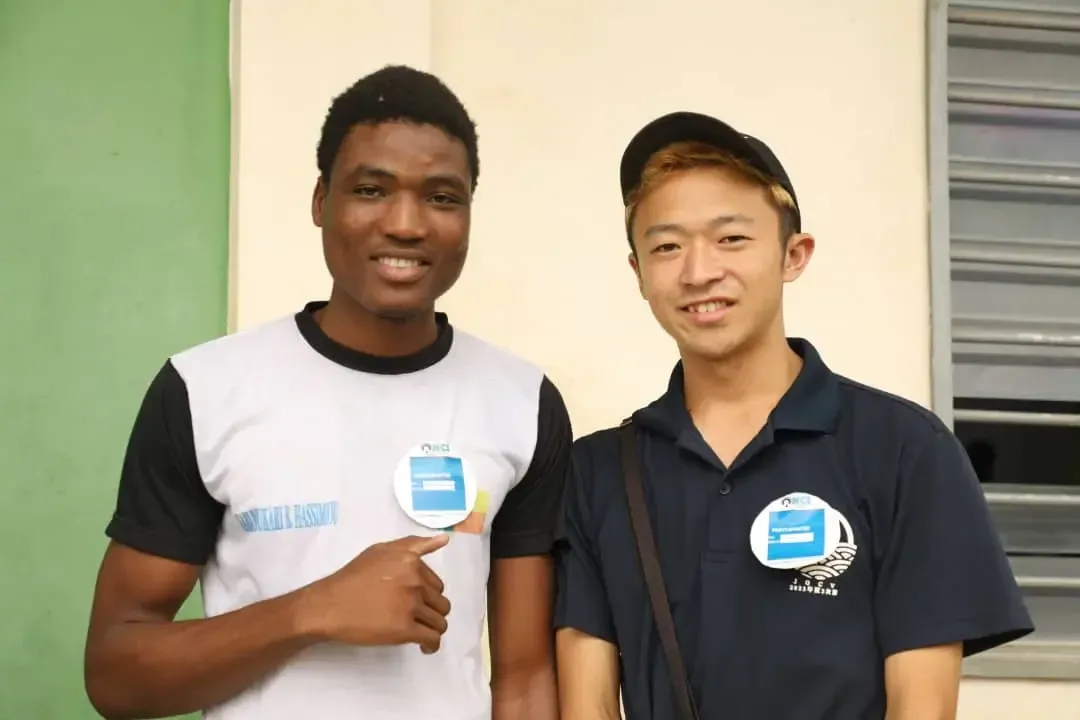Two participants wearing NCI badges.
