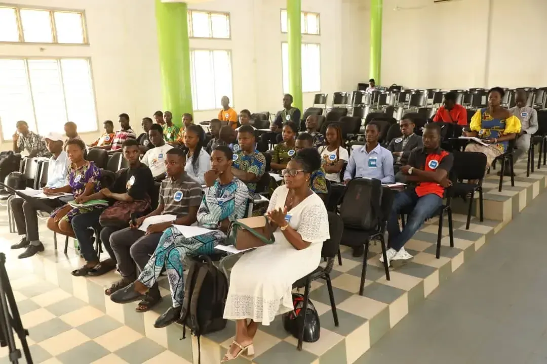 The audience gathered in the lecture hall.