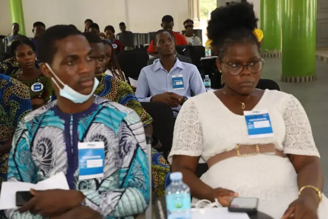 Participants seated in the hall.
