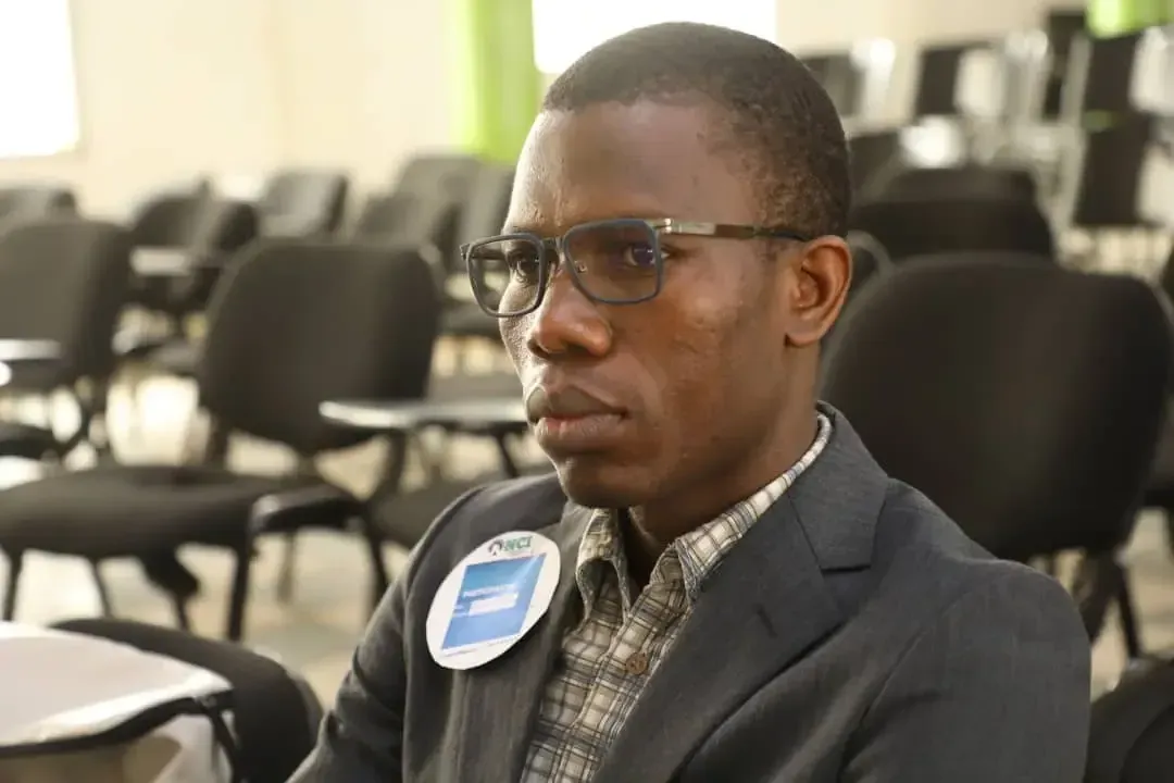A participant listening during a talk.