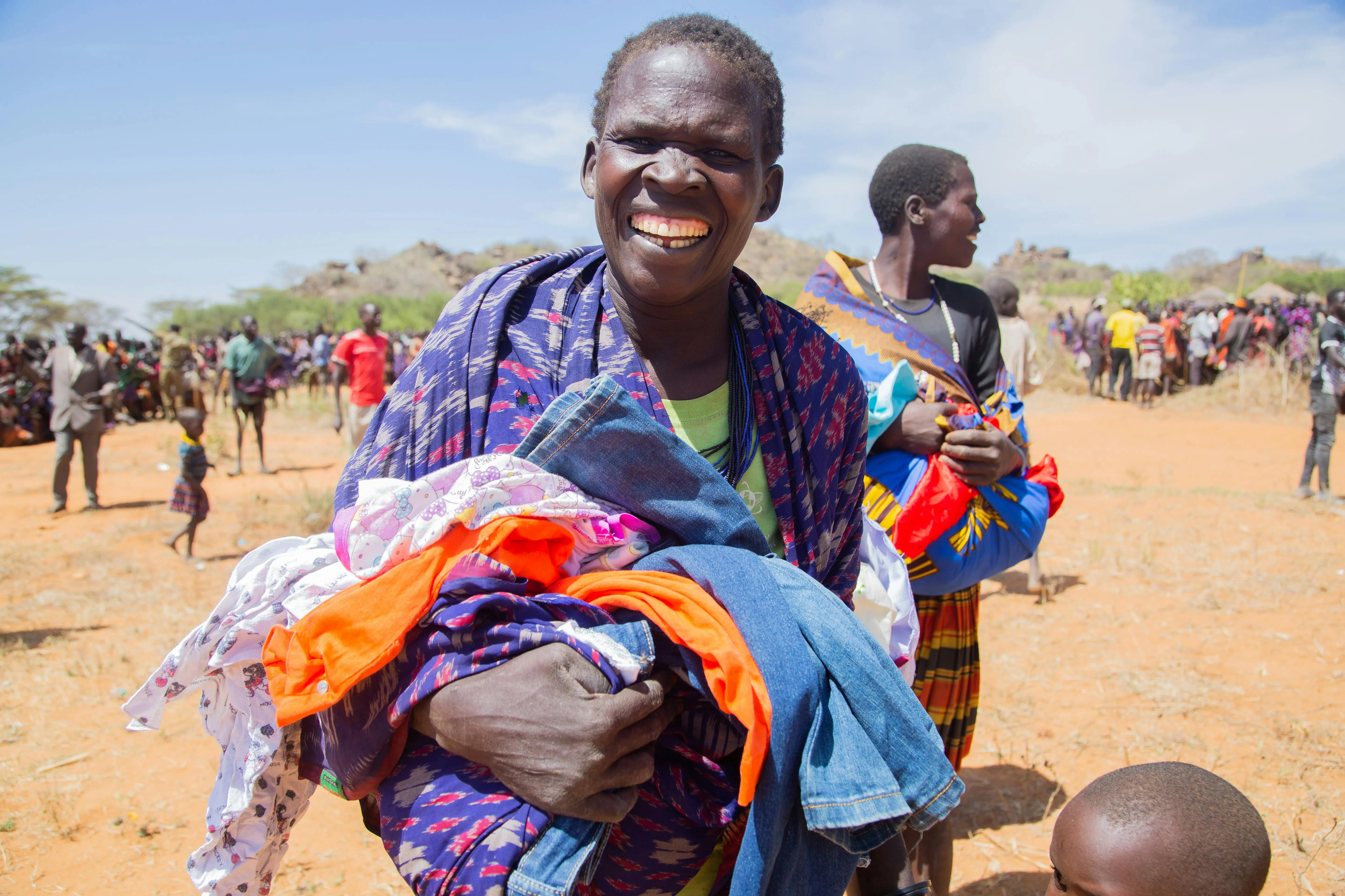 Smiling children from the Mumias community, Kenya, benefiting from WOPLAH's programs.